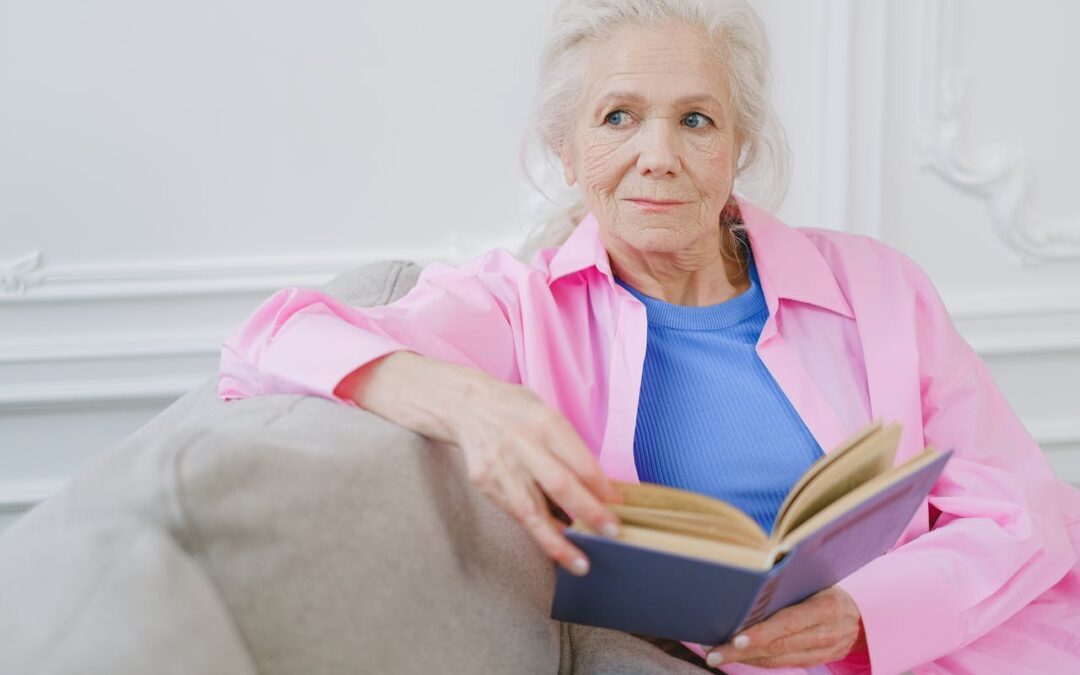 Wise senior woman reading a book